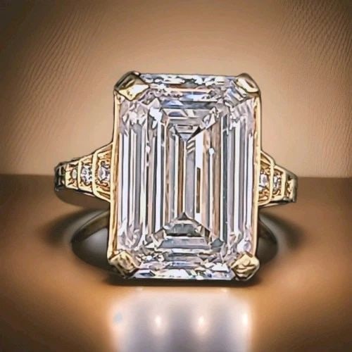 VINTAGE 14K YELLOW GOLD ENGAGEMENT RING 7.73CT. LAB-GROWN DIAMOND EMERALD CUT: VINTAGE 14K YELLOW GOLD ENGAGEMENT RING 7.73CT. LAB-GROWN DIAMOND EMERALD CUT Vintage filigree 14K yellow gold ring featuring an elegant openwork design. The center is set with a stunning lab-grown re