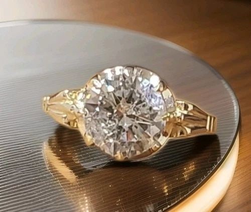 14K YELLOW GOLD VINTAGE ENGAGEMENT RING 2.20CT. LAB-GROWN ROUND DIAMOND: 14K YELLOW GOLD VINTAGE ENGAGEMENT RING 2.20CT. LAB-GROWN ROUND DIAMOND This stunning vintage Art Deco engagement ring is crafted in solid 14K yellow gold and features a lab-grown round-cut diamond at