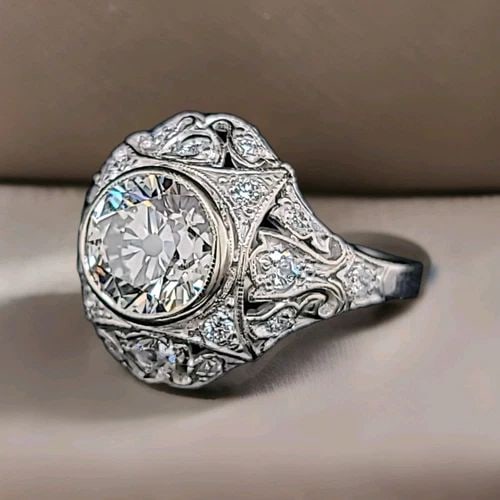 VINTAGE FILIGRE 14K WHITE GOLD RING 1.72CT.OLD EURO CUT ROUND LAB GROWN DIAMOND: VINTAGE FILIGRE 14K WHITE GOLD RING 1.72CT.OLD EURO CUT ROUND LAB GROWN DIAMOND This Vintage Filigree 14k White Gold Ring features a beautiful 1.72CT Old Euro Cut Round Lab Grown Diamond as the main s