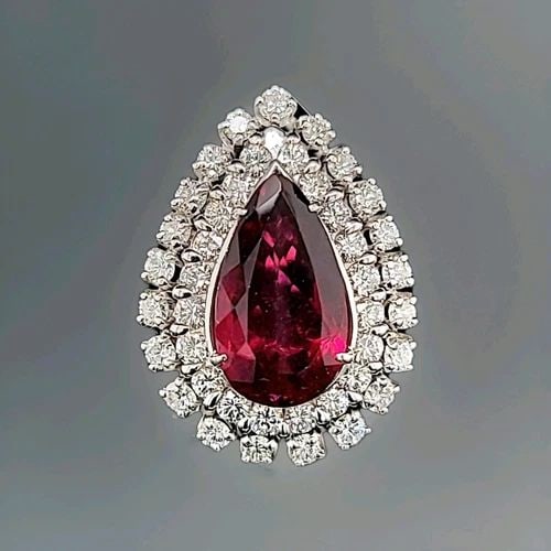 VINTAGE 14K WHITE GOLD ENGAGEMENT RING 5.63CT. NATURAL RUBELLITE TOURMALINE PEAR: VINTAGE 14K WHITE GOLD ENGAGEMENT RING 5.63CT. NATURAL RUBELLITE TOURMALINE PEAR This Vintage 14k White Gold Engagement Ring features a stunning 5.63ct Natural Rubellite Tourmaline in a Pear shape as 