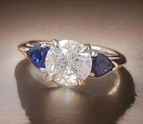 PLATINUM VINTAGE ENGAGEMENT RING 1.71CT.NATURAL ROUND DIAMOND BLUE SAPPHIRE PEAR: PLATINUM VINTAGE ENGAGEMENT RING 1.71CT.NATURAL ROUND DIAMOND BLUE SAPPHIRE PEAR This exquisite vintage platinum ring features a timeless three-stone design with a 1.71-carat natural round-cut diamond