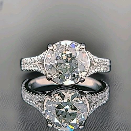VINTAGE PLATINUM ENGAGEMENT RING 2.35CT.LAB GROWN DIAMOND OLD EURO CUT VS-J-K: VINTAGE PLATINUM ENGAGEMENT RING 2.35CT.LAB GROWN DIAMOND OLD EURO CUT VS-J-K This Vintage Platinum Engagement Ring features a 2.35CT lab grown diamond in an old Euro cut, accented by smaller diamonds