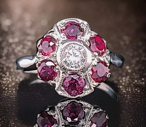 PLATINUM VINTAGE ENGAGEMENT RING 1.53CT. NATURAL RUBY ROUND SHAPE DIAMOND: PLATINUM VINTAGE ENGAGEMENT RING 1.53CT. NATURAL RUBY ROUND SHAPE DIAMOND This Platinum Vintage Engagement Ring features a 1.53ct. Natural ruby set in a round Diamond. The ring has a classic round sha