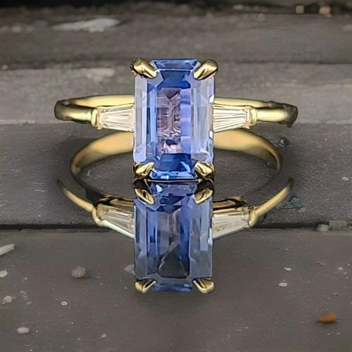 VINTAGE 14K YELLOW GOLD ENGAGEMENT RING 2.03CT. NATURA UNTREATED BLUE SAPPHIRE: VINTAGE 14K YELLOW GOLD ENGAGEMENT RING 2.03CT. NATURA UNTREATED BLUE SAPPHIRE This vintage engagement ring boasts a stunning 2.03 carat blue sapphire stone set in 14K yellow gold. The solitaire setti