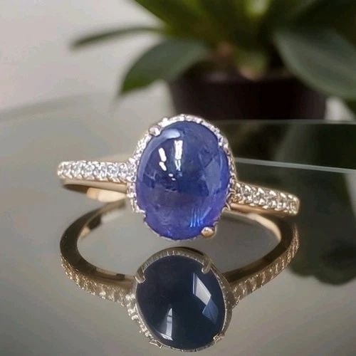 3.52CT. NATURAL BLUE SAPPHIRE CABOCHON SHAPE VINTAGE PLATINUM ENGAGEMENT RING: 3.52CT. NATURAL BLUE SAPPHIRE CABOCHON SHAPE VINTAGE PLATINUM ENGAGEMENT RING This stunning platinum engagement ring features a natural heated blue sapphire in an elegant cabochon cut, weighing 3.52 c