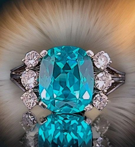 VINTAGE 18K WHITE GOLD ENGAGEMENT RING 6.28CT. BLUE TOURMALINE CUSHION SHAPE: VINTAGE 18K WHITE GOLD ENGAGEMENT RING 6.28CT. BLUE TOURMALINE CUSHION SHAPE This stunning vintage ring features a cushion-cut lab-grown blue tourmaline with a vibrant neon blue color, center weighing