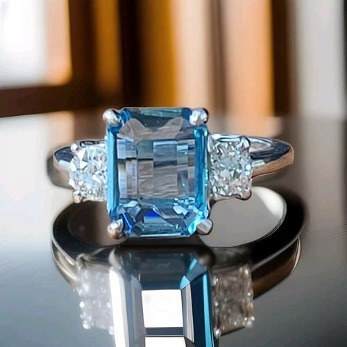 VINTAGE PLATINUM ENGAGEMENT RING 2.87CT. NATURAL BLUE AQUAMARINE EMERALD SHAPE: VINTAGE PLATINUM ENGAGEMENT RING 2.87CT. NATURAL BLUE AQUAMARINE EMERALD SHAPE This stunning vintage platinum ring features a 2.87ct natural blue aquamarine with an emerald shape. The ring is adorned 