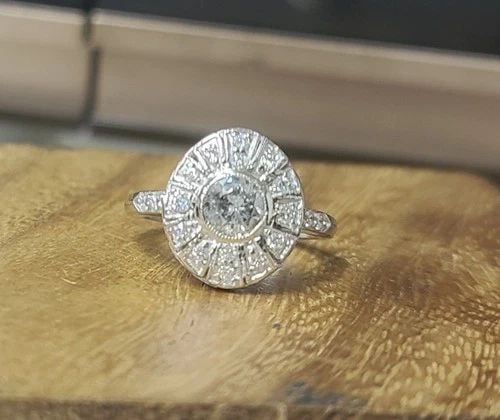 14K WHITE GOLD VINTAGE ENGAGEMENT RING 1.20CT NATURAL DIAMOND ROUND SHAPE: 14K WHITE GOLD VINTAGE ENGAGEMENT RING 1.20CT NATURAL DIAMOND ROUND SHAPE This beautiful vintage ring is crafted in solid 14K white gold and dates to the 1940s. It features a natural diamond at its ce
