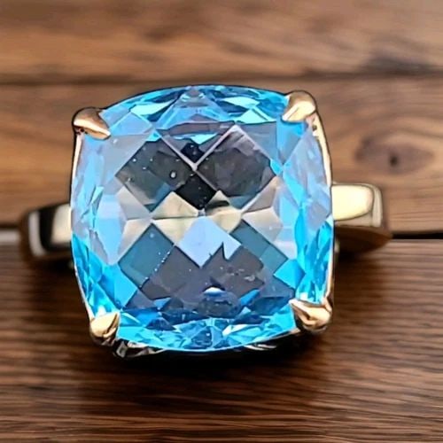 TIFFANY & CO 18K YELLOW GOLD ENGAGEMENT RING 10.94CT. BLUE TOPAZ CUSHION SHAPE: Tiffany & Co 10.94 carat natural blue topaz set in an 18k yellow gold ring This blue topaz has a gorgeous sky-blue color clean,superb cut, brilliant The measurements are 14x14mm cushion shape ring Siz