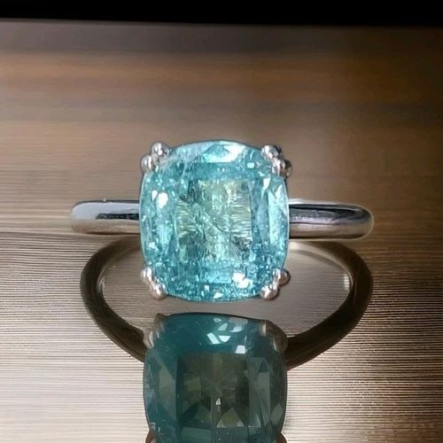 VINTAGE 14K WHITE GOLD ENGAGEMENT RING 5.50CT.BLUE NEON TOURMALINE CUSHION: VINTAGE 14K WHITE GOLD ENGAGEMENT RING 5.50CT.BLUE NEON TOURMALINE CUSHION This gorgeous vintage 14K white gold engagement ring features a stunning natural blue tourmaline in an elegant cushion shape,