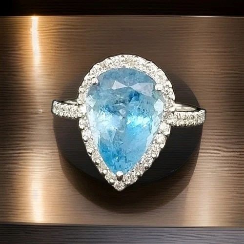 5.03CT NATURAL PEAR AQUAMARINE RING 14K WHITE GOLD WITH 0.75CT DIAMOND ACCENTS: 14K WHITE GOLD RING 5.03CT.NATURAL AQUAMARINE IN PEAR SHAPE Gorgeous elegant 14k white gold ring natural aquamarine pear shape Center natural aquamarine in pear shape weight 5.03ct. size 14x10mm very 