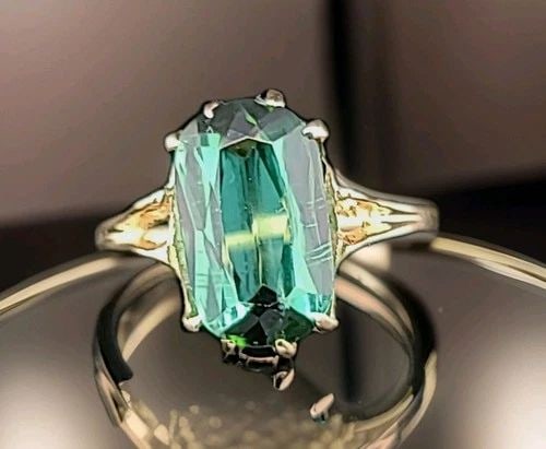 VINTAGE 14K YELLOW GOLD ENGAGEMENT RING 3.87CT. NATURAL GREEN TOURMALINE: VINTAGE 14K YELLOW GOLD ENGAGEMENT RING 3.87CT. NATURAL GREEN TOURMALINE This vintage 14k yellow gold engagement ring features a stunning 3.87CT natural green tourmaline as the main stone. The cushion