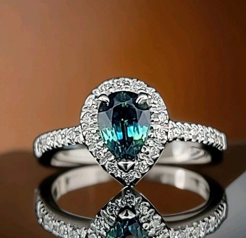 14K WHITE GOLD 1.23CT. NATURAL PEAR TEAL GREEN-BLUE SAPPHIRE ENGAGEMENT RING: 14K WHITE GOLD ENGAGEMENT RING 1.23CT. NATURAL TEAL SAPPHIRE PEAR SHAPE Stunning 14k white gold engagement ring natural untreated sapphire in pear shape ,center set natural teal green blue sapphire we