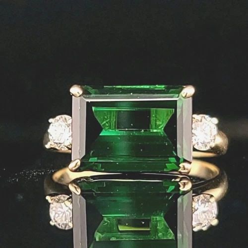 VINTAGE 14K YELLOW ENGAGEMENT RING 5.07CT. NATURAL GREEN TOURMALINE EMERALD CUT: VINTAGE 14K YELLOW ENGAGEMENT RING 5.07CT. NATURAL GREEN TOURMALINE EMERALD CUT This vintage 14k yellow gold engagement ring is a stunning piece of fine jewelry that will catch the eye of any collecto