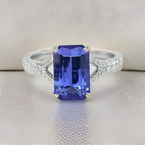 14K WHITE GOLD ENGAGEMENT RING 3.30CT. NATURAL TANZANITE RECTANGULAR SHAPE: 14K WHITE GOLD RING 3.30CT. NATURAL TANZANITE EMERALD CUT 14kwg ring natural Tanzanite Emerald shape weight 3.30ct.size 11x7 very nice rich medium dark blue color nice luster very lively ,brilliant st