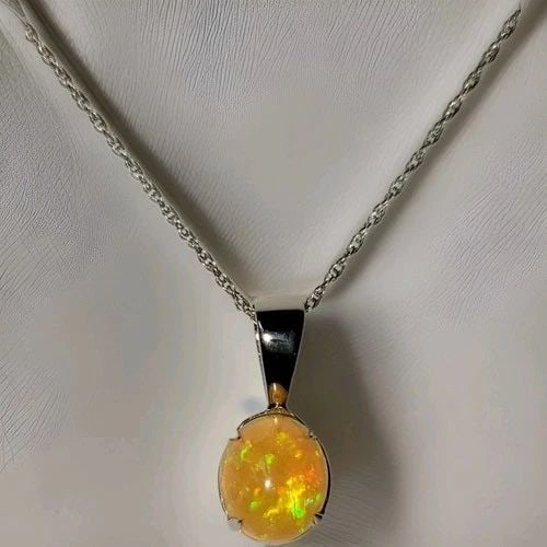 VINTAGE 14K WHITE GOLD NECKLACE PENDANT NATURAL OPAL 4.95CT. OVAL CABOCHON: VINTAGE 14K WHITE GOLD NECKLACE PENDANT NATURAL OPAL 4.95CT. OVAL CABOCHON Gorgeous vintage 14k white gold natural opal pendant necklace in 16 inch long. center natural opal the multie colors oval cab