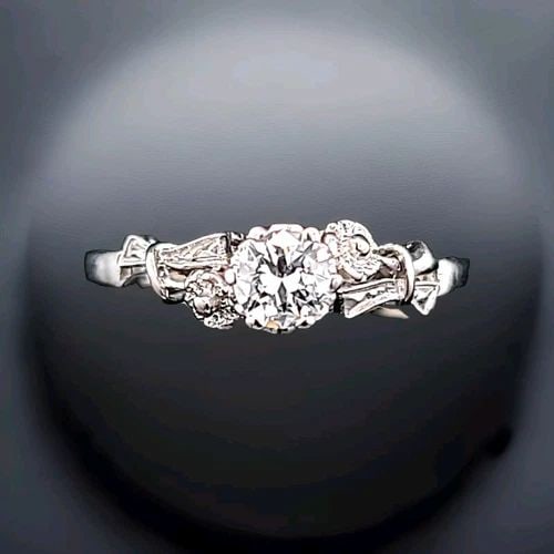 PLATINUM VINTAGE FILIGREE ENGAGEMENT RING 0.38CT. NATURAL OLD EURO CUT DIAMOND: PLATINUM VINTAGE FILIGREE ENGAGEMENT RING 0.38CT. NATURAL OLD EURO CUT DIAMOND This stunning vintage engagement ring is a true beauty. Crafted from platinum, it features a round old Euro cut diamond w