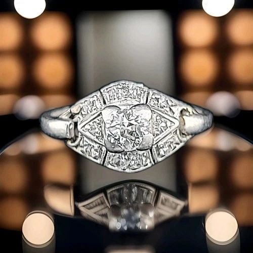 PLATINUM VINTAGE ENGAGEMENT RING 0.57CT. NATURAL OLD EURO ROUND DIAMOND: PLATINUM VINTAGE ENGAGEMENT RING 0.57CT. NATURAL OLD EURO ROUND DIAMOND Beautiful vintage platinum ring featuring a natural round old mine cut diamond, dating to the 1930s. Details: Center stone: Natu