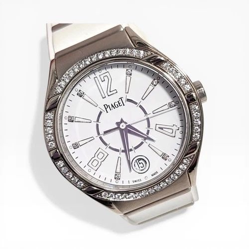 PIAGET POLO LADIES 38 MM 18K WHITE GOLD DIAMOND RUBBER STRAP QUARTZ WATCH: PIAGET POLO LADIES 38 MM 18K WHITE GOLD DIAMOND RUBBER STRAP QUARTZ WATCH Manufacturer Piaget Category Polo Reference Number P10726 Band Type Rubber Bezel Diamonds Bezel Box No Case Mes 38 mm Case Typ