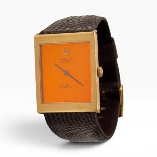 ROLEX CELLINI 22 X 28 MM ORANGE DIAL 18K YELLOW GOLD LEATHER QUARTZ WATCH 4014: ROLEX CELLINI 22 X 28 MM ORANGE DIAL 18K YELLOW GOLD LEATHER QUARTZ WATCH 4014 Manufacturer Cellini Category Classic Reference Number 4014 Additional Keywords ORANGE DIAL Band Type Leather Box No Case