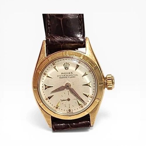 VINTAGE ROLEX OYSTER PERPETUAL SERPICO Y LAINO 24 MM YELLOW GOLD WATCH 6505 1963: VINTAGE ROLEX OYSTER PERPETUAL SERPICO Y LAINO 24 MM YELLOW GOLD WATCH Manufacturer Rolex Category Vintage Reference Number 6505 Additional Keywords SERPICO Y LAINO Band Leather Band Color Brown Band 