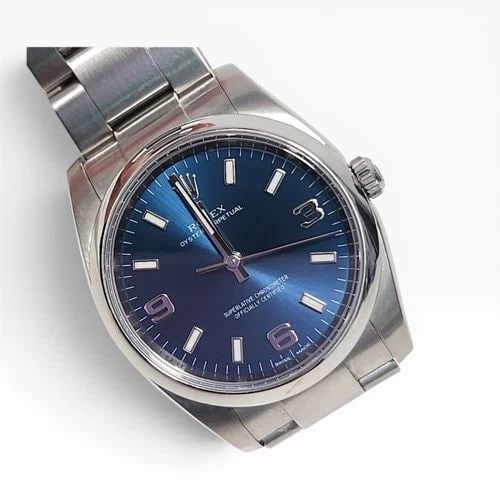 ROLEX OYSTER PERPETUAL 34 MM BLUE DIAL STEEL AUTOMATIC WATCH 114200 REHAUT: ROLEX OYSTER PERPETUAL 34 MM BLUE DIAL STEEL AUTOMATIC WATCH 114200 REHAUT Manufacturer Rolex Category Oyster Perpetual Reference Number 114200 Band Stainless Steel Band Color Steel Band Type Oyster B
