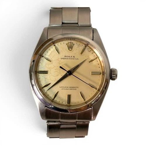 W/BOX ROLEX OYSTER PERPETUAL 34 MM FADED CREAM DIAL WATCH 1002 CIRCA 1961: W/BOX ROLEX OYSTER PERPETUAL 34 MM FADED CREAM DIAL WATCH 1002 CIRCA 1961 Manufacturer Rolex Category Mens No Date 34mm Subcategory Plastic Crystal Reference Number 1002 Band Stainless Steel Band Colo