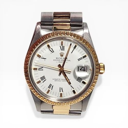ROLEX DATE 34 MM TWO TONE OYSTER WHITE ROMAN AUTOMATIC WATCH 15053 CIRCA 1981: ROLEX DATE 34 MM TWO TONE OYSTER WHITE ROMAN AUTOMATIC WATCH Manufacturer Rolex Category Mens Date 34mm Subcategory Plastic Crystal Quick Set Reference Number 15053 Band Steel ,Yellow Gold Band Color 