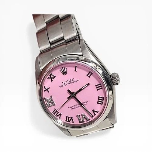 ROLEX OYSTER PERPETUAL 34 MM CANDY PINK DIAMOND DIAL STEEL WATCH 1002 CIRCA 1964: ROLEX OYSTER PERPETUAL 34 MM CANDY PINK DIAMOND DIAL STEEL WATCH Manufacturer Rolex Category Mens No Date 34mm Subcategory Plastic Crystal Reference Number 1002 Additional Keywords CANDY PINK DIAMONDS