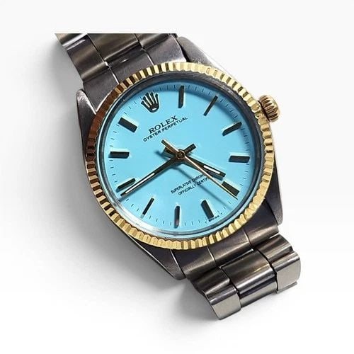 ROLEX OYSTER PERPETUAL 34 MM TWO TONE BLUE TURQUOISE DIAL WATCH 1002 CIRCA 1967: ROLEX OYSTER PERPETUAL 34 MM TWO TONE BLUE TURQUOISE DIAL WATCH 1002 CIRCA 1967 Manufacturer Rolex Category Mens No Date 34mm Subcategory Plastic Crystal Reference Number 1002 Band Stainless Steel Ban