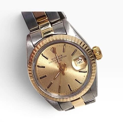 ROLEX LADIES DATE 26MM TWO TONE OYSTER CHAMPAGNE AUTOMATIC WATCH 6917 CIRCA 1979: ROLEX LADIES DATE 26MM TWO TONE OYSTER CHAMPAGNE AUTOMATIC WATCH 6917 CIRCA 1979 Manufacturer Rolex Category Oyster Perpetual Ladies Date Reference Number 6917 Band Steel ,Yellow Gold Band Color Yello