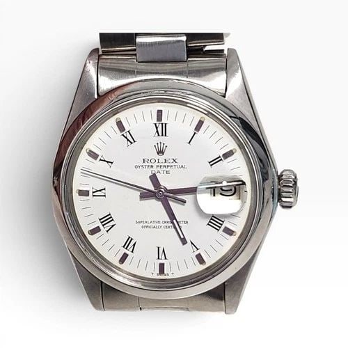 ROLEX DATE 34 MM STEEL WHITE ROMAN OYSTER AUTOMATIC WATCH 1500 CIRCA 1973: ROLEX DATE 34 MM STEEL WHITE ROMAN OYSTER AUTOMATIC WATCH 1500 CIRCA 1973 Manufacturer Rolex Category Mens Date 34mm Subcategory Plastic Crystal Non Quick Reference Number 1500 Band Stainless Steel Ba