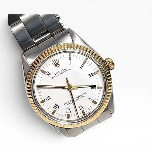 VINTAGE ROLEX OYSTER PERPETUAL 34 MM TWO TONE WHITE DIAL WATCH 1002 CIRCA 1963: VINTAGE ROLEX OYSTER PERPETUAL 34 MM TWO TONE WHITE DIAL WATCH 1002 CIRCA 1963 Manufacturer Rolex Category Mens No Date 34mm Subcategory Plastic Crystal Reference Number 1002 Additional Keywords Band 