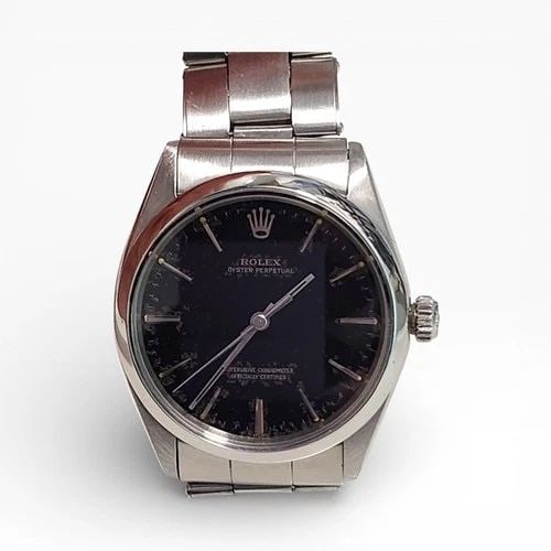 VINTAGE ROLEX OYSTER PERPETUAL 34 MM BLACK GILT DIAL STEEL WATCH 1002 CIRCA 1966: VINTAGE ROLEX OYSTER PERPETUAL 34 MM BLACK GILT DIAL STEEL WATCH Manufacturer Rolex Category Mens No Date 34mm Subcategory Plastic Crystal Reference Number 1002 Additional Keywords GILT DIAL VINTAGE B