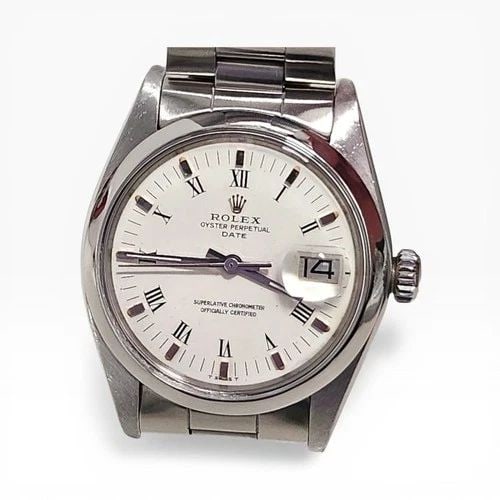 ROLEX DATE 34 MM STEEL WHITE ROMAN OYSTER AUTOMATIC WATCH 1500 CIRCA 1975: ROLEX DATE 34 MM STEEL WHITE ROMAN OYSTER AUTOMATIC WATCH Manufacturer Rolex Category Mens Date 34mm Subcategory Plastic Crystal Non Quick Reference Number 1500 Band Stainless Steel Band Color Steel B