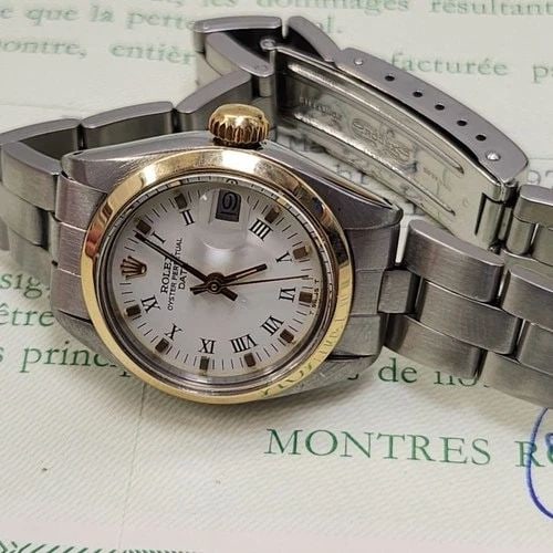 W/PAPERS 1979 ROLEX LADIES DATE 26 MM TWO TONE WHITE ROMAN AUTOMATIC WATCH 6916: W/PAPERS 1979 ROLEX LADIES DATE 26 MM TWO TONE WHITE ROMAN AUTOMATIC WATCH Manufacturer Rolex Category Oyster Perpetual Ladies Date Reference Number 6916 Band Stainless Steel Band Color Steel Band Typ