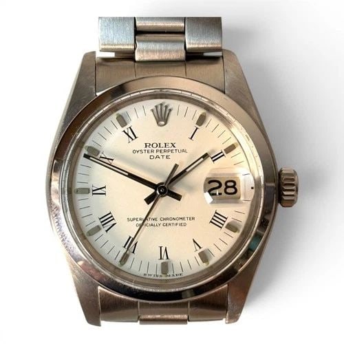 ROLEX DATE 34 MM STEEL WHITE ROMAN OYSTER AUTOMATIC WATCH 1500 CIRCA 1974: ROLEX DATE 34 MM STEEL WHITE ROMAN OYSTER AUTOMATIC WATCH 1500 CIRCA 1974 Manufacturer Rolex Category Mens Date 34mm Subcategory Plastic Crystal Non Quick Reference Number 1500 Band Stainless Steel Ba