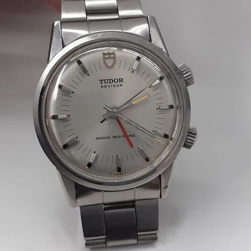 W/SERVICE PAPERS TUDOR HERITAGE ADVISOR ALARM 34 MM STEEL AUTOMATIC WATCH 10050: W/SERVICE PAPERS TUDOR HERITAGE ADVISOR ALARM 34 MM STEEL AUTOMATIC WATCH Manufacturer Tudor Category Complicated Reference Number 10050 Additional Keywords SERVICE PAPERS ALARM Band Gral Condition St