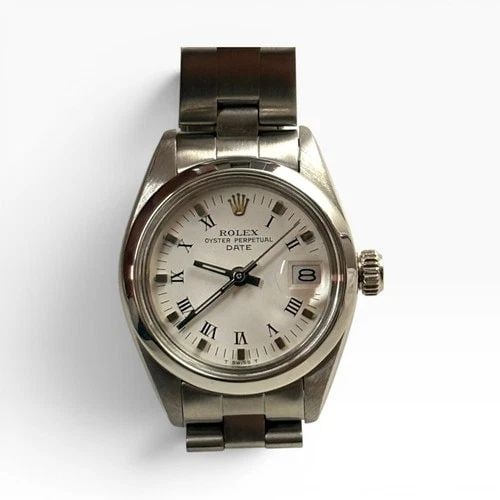 ROLEX LADIES DATE 26 MM WHITE ROMAN OYSTER STEEL AUTOMATIC WATCH 6917 CIRCA 1980: ROLEX LADIES DATE 26 MM WHITE ROMAN OYSTER STEEL AUTOMATIC WATCH 6917 CIRCA 1980 Manufacturer Rolex Category Oyster Perpetual Ladies Date Reference Number 6917 Band Stainless Steel Band Color Steel Ba