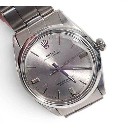 ROLEX OYSTER PERPETUAL 34 MM OYSTER STEEL AUTOMATIC WATCH 1002 CIRCA 1969: ROLEX OYSTER PERPETUAL 34 MM OYSTER STEEL AUTOMATIC WATCH 1002 CIRCA 1969 Manufacturer Rolex Category Mens No Date 34mm Subcategory Plastic Crystal Reference Number 1002 Band Stainless Steel Band Colo