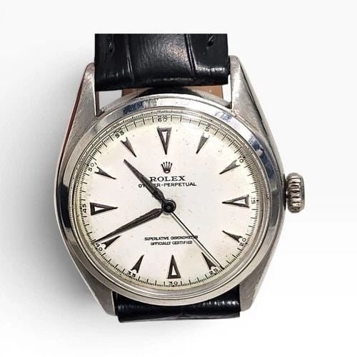 VINTAGE ROLEX OYSTER PERPETUAL 34MM STEEL LEATHER AUTOMATIC WATCH 6084 YEAR 1952: VINTAGE ROLEX OYSTER PERPETUAL 34MM STEEL LEATHER AUTOMATIC WATCH 6084 YEAR 1952 Manufacturer Rolex Category Vintage Reference Number 6084 Additional Keywords RETAILER MAPIN Band Leather Band Type Lea