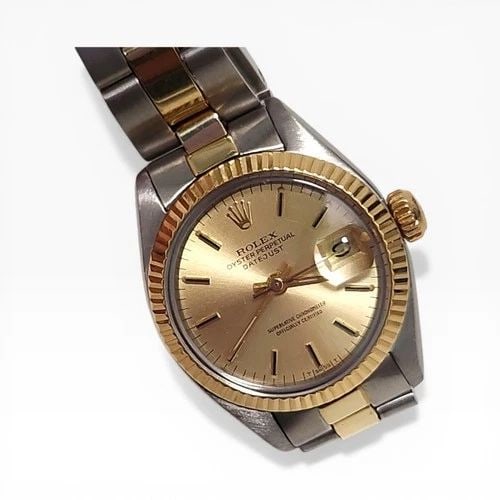 ROLEX LADIES DATEJUST 26 MM TWO TONE CHAMPAGNE OYSTER WATCH 6916 CIRCA 1978: ROLEX LADIES DATEJUST 26 MM TWO TONE CHAMPAGNE OYSTER WATCH Manufacturer Rolex Category Ladies Datejust Reference Number 6916 Band Steel ,Yellow Gold Band Color Yellow Gold & Stainless Steel Band Type