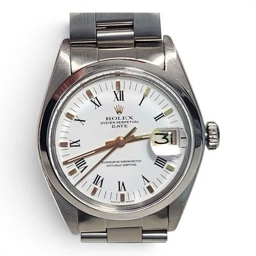 ROLEX DATE 34 MM STEEL WHITE ROMAN OYSTER AUTOMATIC WATCH 1500 CIRCA 1976: ROLEX DATE 34 MM STEEL WHITE ROMAN OYSTER AUTOMATIC WATCH 1500 CIRCA 1976 Manufacturer Rolex Category Mens Date 34mm Subcategory Plastic Crystal Non Quick Reference Number 1500 Band Stainless Steel Ba