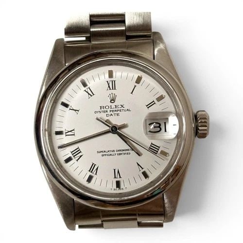 ROLEX DATE 34 MM STEEL WHITE ROMAN OYSTER AUTOMATIC WATCH 1500 CIRCA 1979: ROLEX DATE 34 MM STEEL WHITE ROMAN OYSTER AUTOMATIC WATCH 1500 CIRCA 1979 Manufacturer Rolex Category Mens Date 34mm Subcategory Plastic Crystal Non Quick Reference Number 1500 Band Stainless Steel Ba