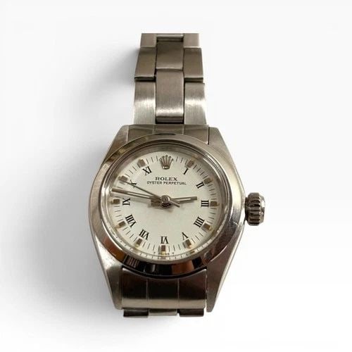 ROLEX OYSTER PERPETUAL LADIES 24 MM WHITE ROMAN AUTOMATIC WATCH 6718 CIRCA 1976: ROLEX OYSTER PERPETUAL LADIES 24 MM WHITE ROMAN AUTOMATIC WATCH 6718 CIRCA 1976 Manufacturer Rolex Category Oyster Perpetual Ladies No Date Subcategory Ladies No Date 2030 Reference Number 6718 Band S
