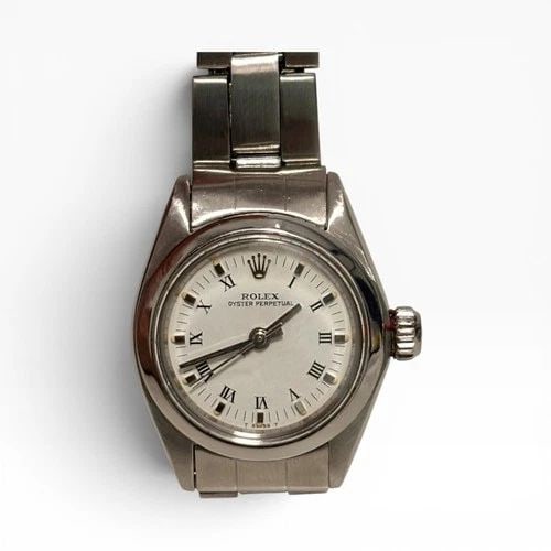 ROLEX OYSTER PERPETUAL LADIES 24 MM WHITE ROMAN AUTOMATIC WATCH 6718 CIRCA 1982: ROLEX OYSTER PERPETUAL LADIES 24 MM WHITE ROMAN AUTOMATIC WATCH 6718 CIRCA 1982 Manufacturer Rolex Category Oyster Perpetual Ladies No Date Subcategory Ladies No Date 2030 Reference Number 6718 Band S