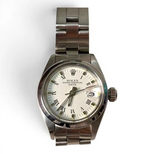 ROLEX LADIES DATE 26 MM STEEL WHITE ROMAN OYSTER AUTOMATIC WATCH 6916 CIRCA 1981: ROLEX LADIES DATE 26 MM STEEL WHITE ROMAN OYSTER AUTOMATIC WATCH 6916 CIRCA 1981 Manufacturer Rolex Category Oyster Perpetual Ladies Date Reference Number 6916 Band Stainless Steel Band Color Steel Ba
