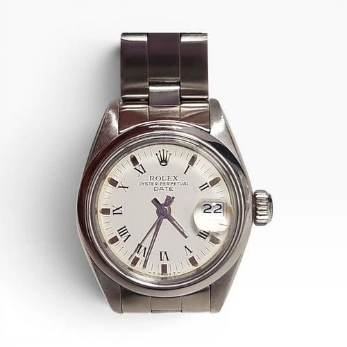 ROLEX LADIES DATE 26 MM WHITE ROMAN OYSTER STEEL AUTOMATIC WATCH 6916 CIRCA 1979: ROLEX LADIES DATE 26 MM WHITE ROMAN OYSTER STEEL AUTOMATIC WATCH 6916 CIRCA 1979 Manufacturer Rolex Category Oyster Perpetual Ladies Date Reference Number 6916 Band Stainless Steel Band Color Steel Ba