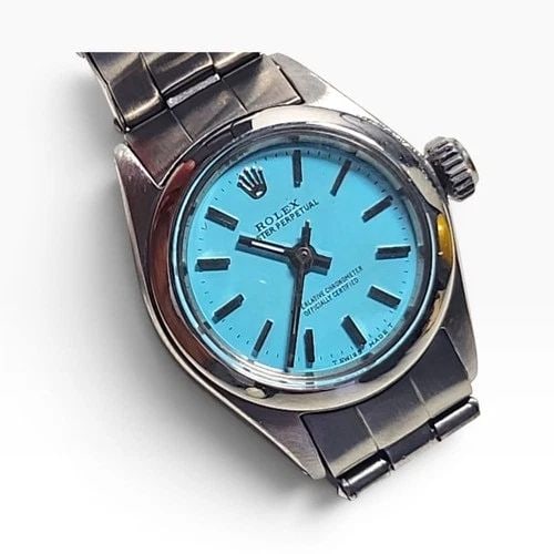 ROLEX OYSTER PERPETUAL LADY 26 MM BLUE TURQUOISE AUTOMATIC WATCH 6618 CIRCA 1965: ROLEX OYSTER PERPETUAL LADY 26 MM BLUE TURQUOISE AUTOMATIC WATCH 6618 CIRCA 1965 Manufacturer Rolex Category Oyster Perpetual Ladies No Date Reference Number 6618 Band Stainless Steel Band Color Steel