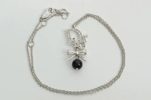 AUTHENTIC CHRISTIAN DIOR MONOGRAM RHINESTONE SP RIBBON BLACK BALL CHARM NECKLACE: AUTHENTIC CHRISTIAN DIOR MONOGRAM RHINESTONE SP RIBBON BLACK BALL CHARM NECKLACE Authentic Christian Dior Monogram Rhinestone SP Ribbon Black Ball Charm Necklace AUTHENTIC CHRISTIAN DIOR MONOGRAM RHIN